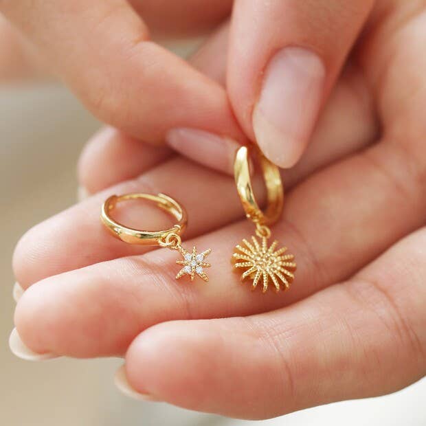 Sunburst and Star Charm Huggie Hoop Earrings in Gold