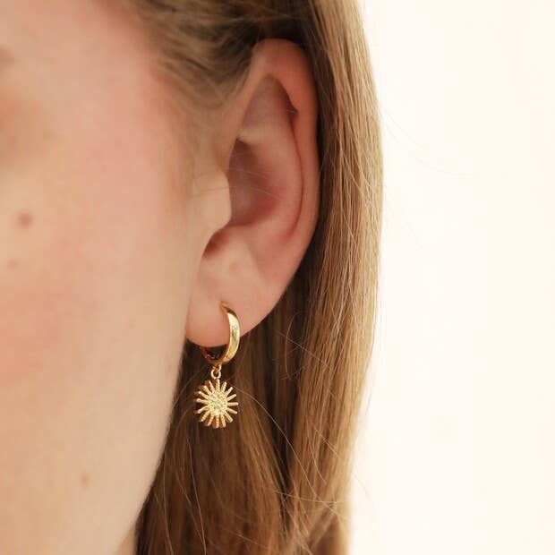Sunburst and Star Charm Huggie Hoop Earrings in Gold